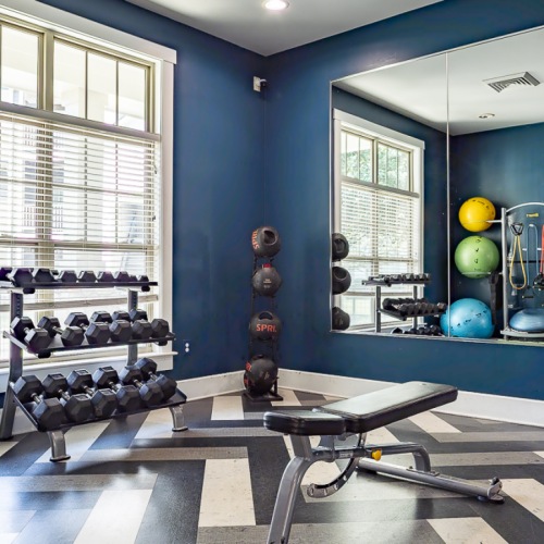Workout in style in our 24-hour fitness center Fitness center with workout equipment