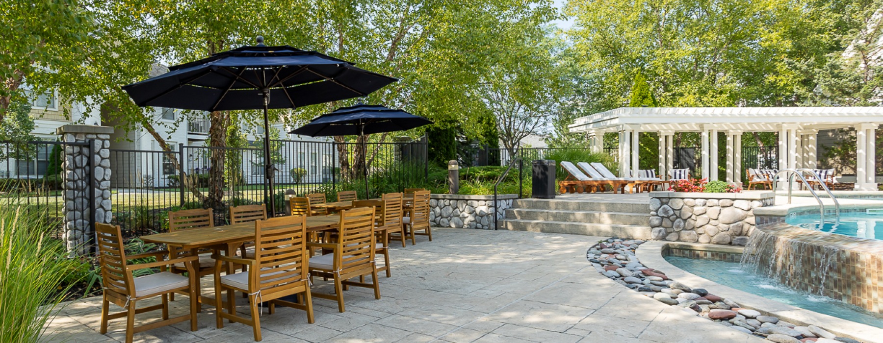 Sundeck with umbrella-covered tables