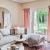 a living room with a couch and a mirror